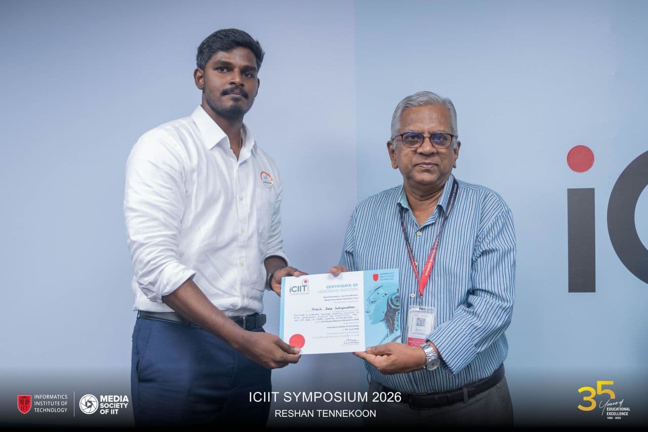 Receiving the honourable mention certificate at the ICIIT Symposium 2026